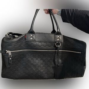 Signature Gucci Black embossed leather duffle bag